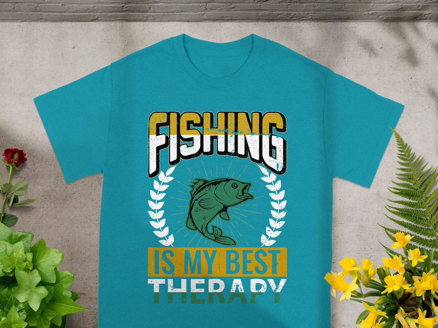 Teal t-shirt with text that reads "FISHING IS MY BEST THERAPY" and a fish graphic.