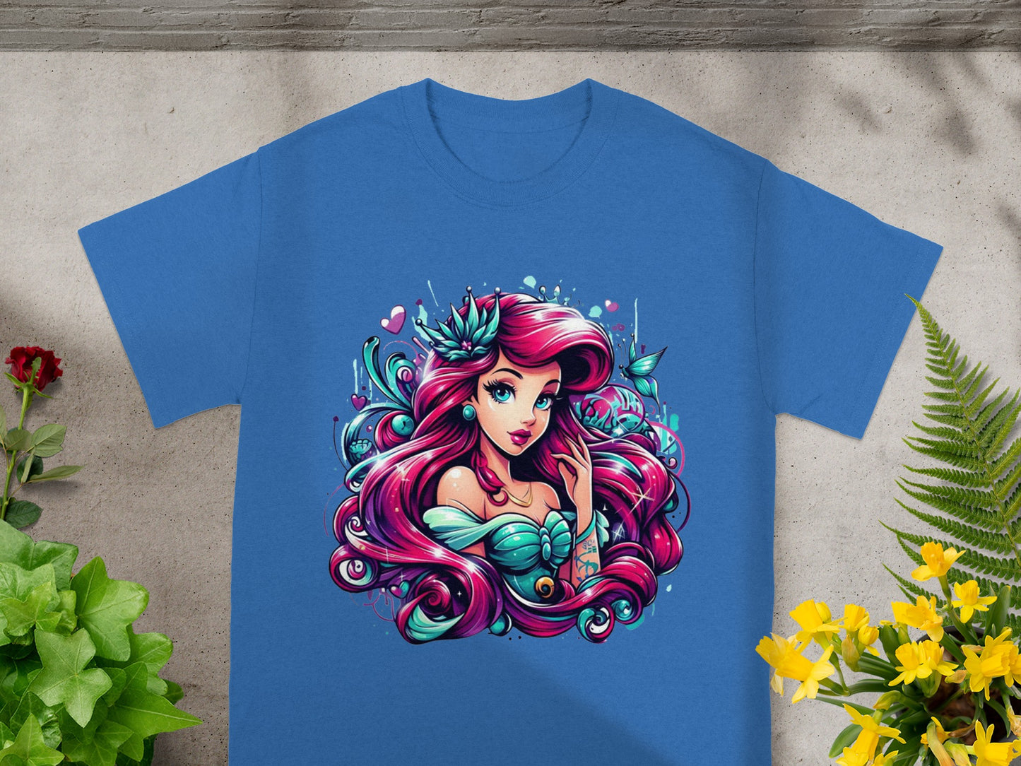 Blue t-shirt featuring a colorful illustration of Ariel from The Little Mermaid.