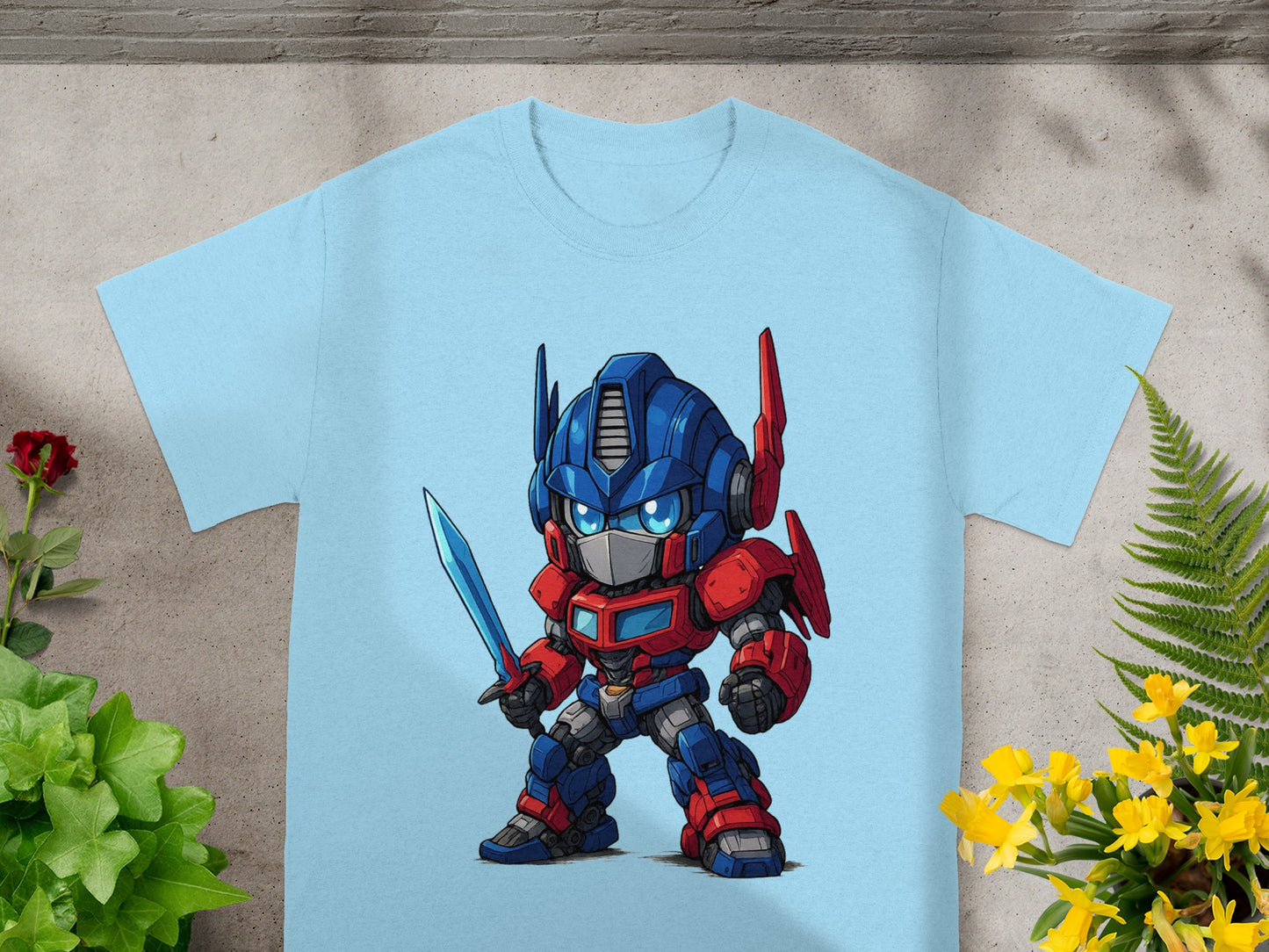 Light blue t-shirt with a cartoon Optimus Prime character holding a sword.