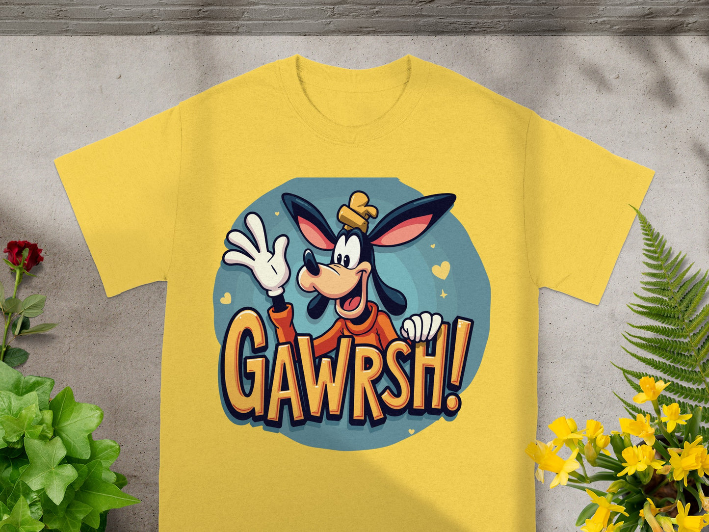 Yellow t-shirt with cartoon Goofy saying "GAWRSH!".