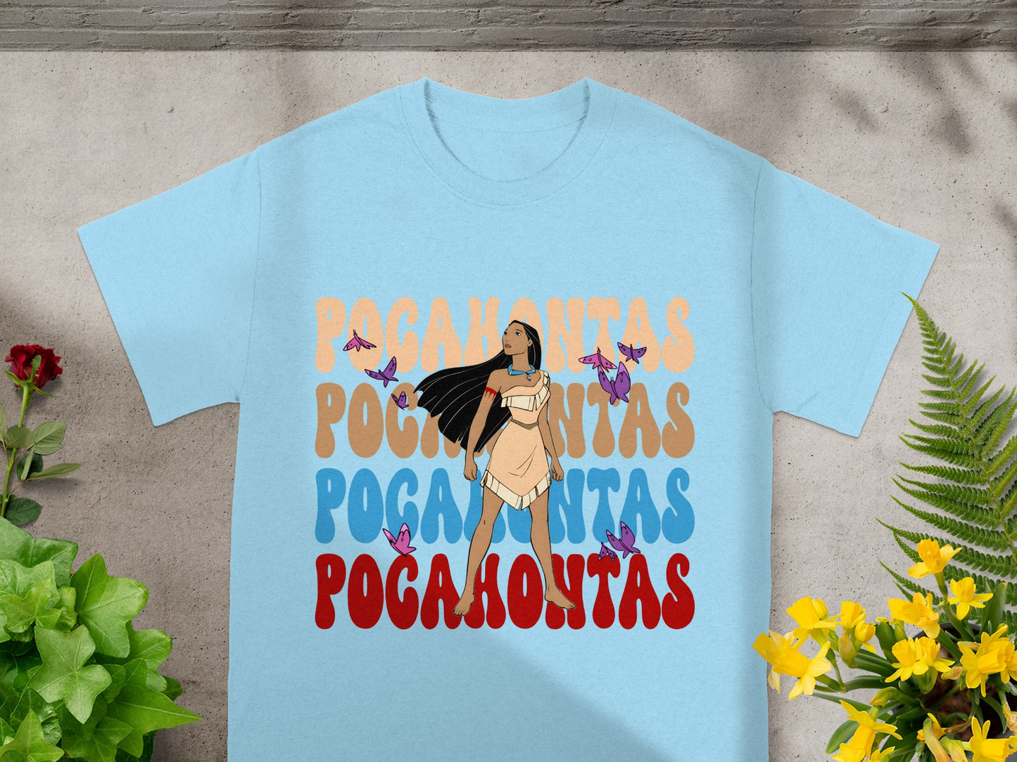 Light blue t-shirt featuring Pocahontas graphic and butterfly illustrations.
