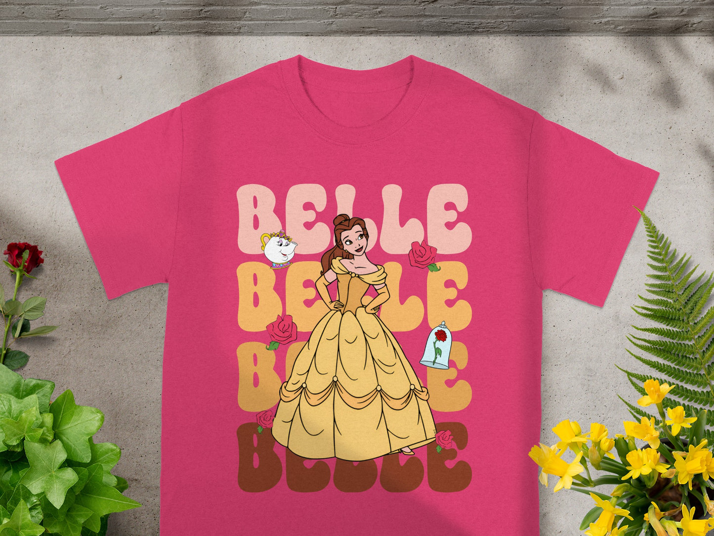 Pink t-shirt with Belle from Beauty and the Beast graphic and "Belle" text.