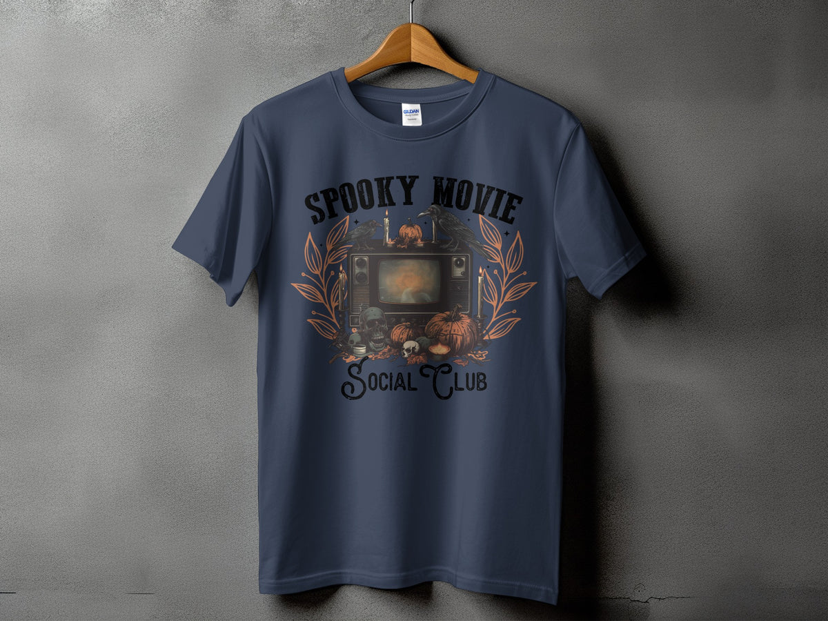 T-shirt with spooky Halloween graphic featuring vintage TV, pumpkins, skulls, and crows.
