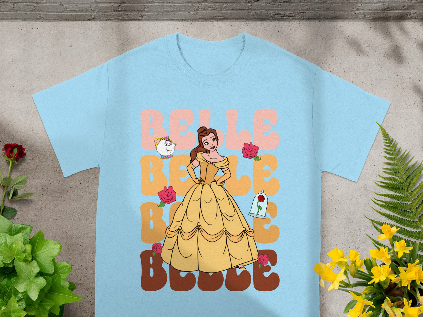 Belle from Beauty and the Beast in yellow gown with teacup and roses.