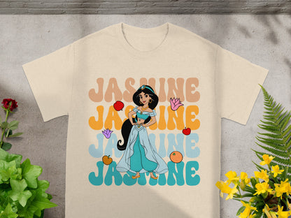 Light tan t-shirt with colorful "JASMINE" text and Disney's Jasmine.