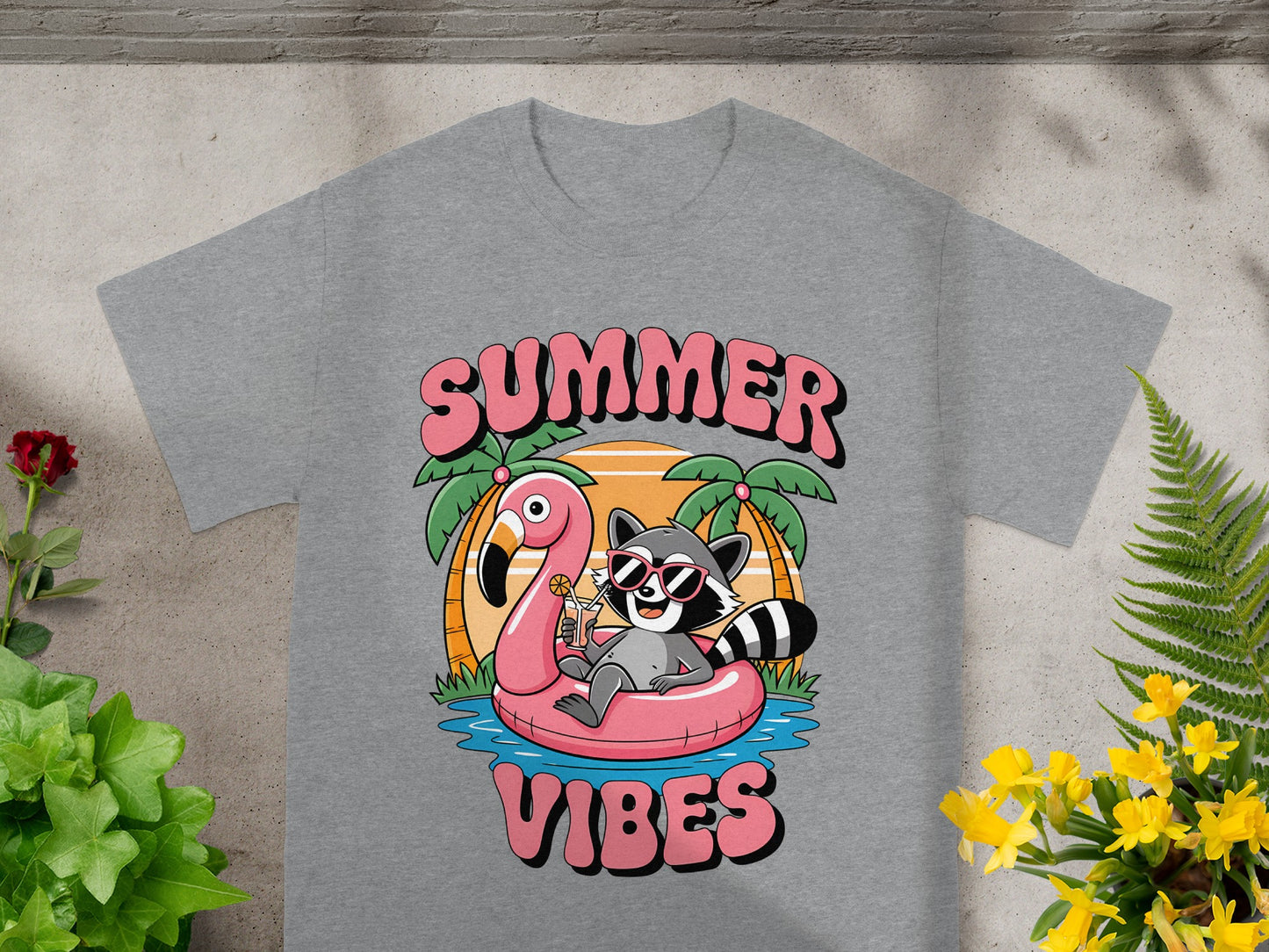 Grey t-shirt with "SUMMER VIBES" text and raccoon on flamingo float.