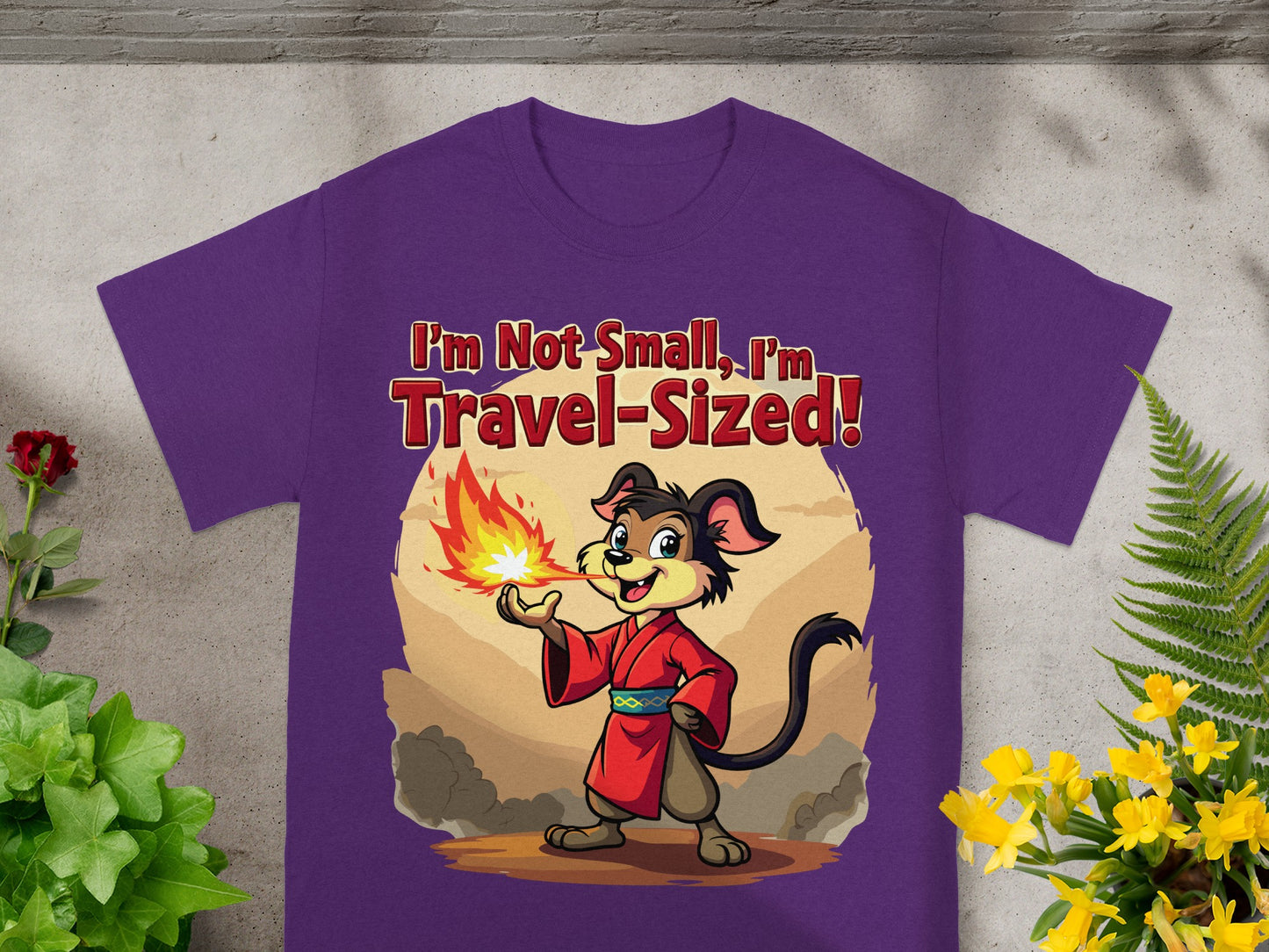 Purple t-shirt with a cartoon dog breathing fire and text "I'm Not Small, I'm Travel-Sized!".