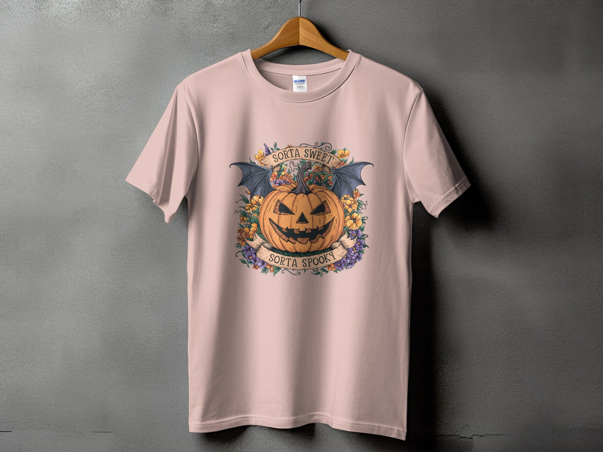Pink t-shirt with jack-o'-lantern, bat wings, flowers, and text "Sorta Sweet Sorta Spooky".