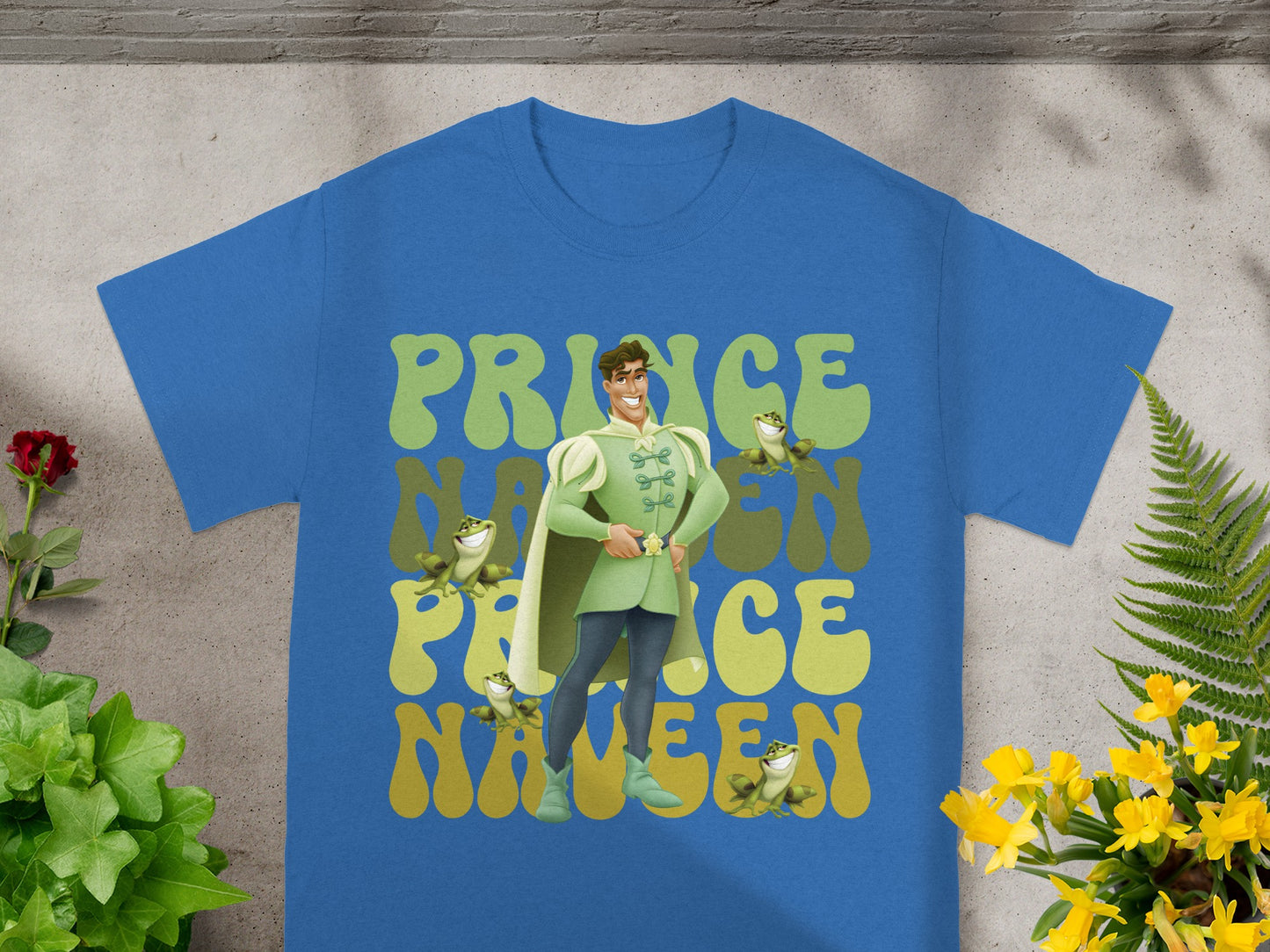 Blue t-shirt with green cartoon prince and "Prince Naveen" text.