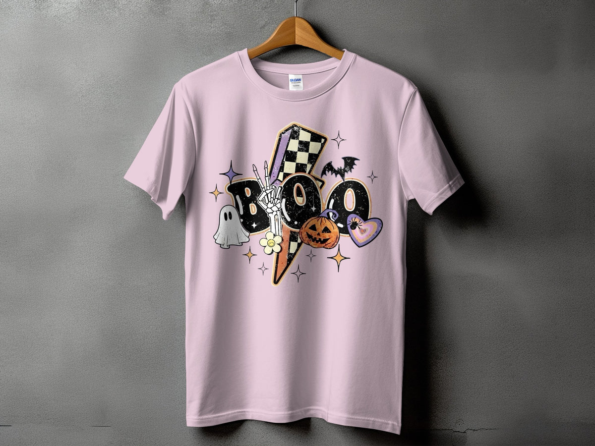 Pink t-shirt with "BOO" Halloween graphic featuring ghost, skeleton hand, pumpkin, and bat.