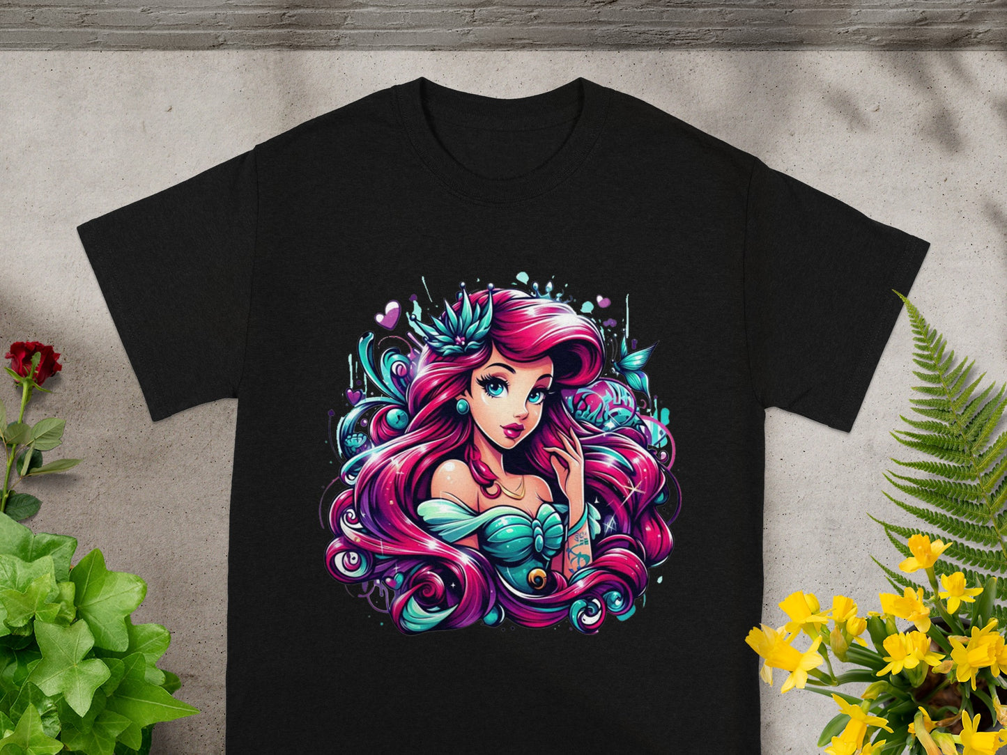 Black t-shirt with vibrant Ariel-inspired illustration.