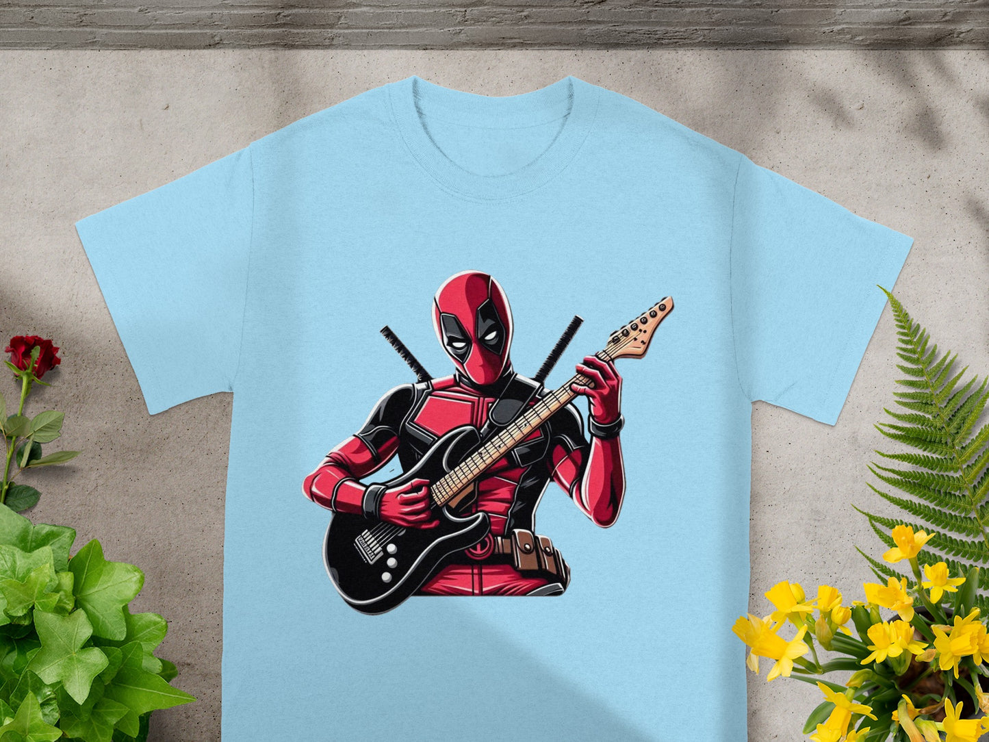 Deadpool in red and black playing a black electric guitar.