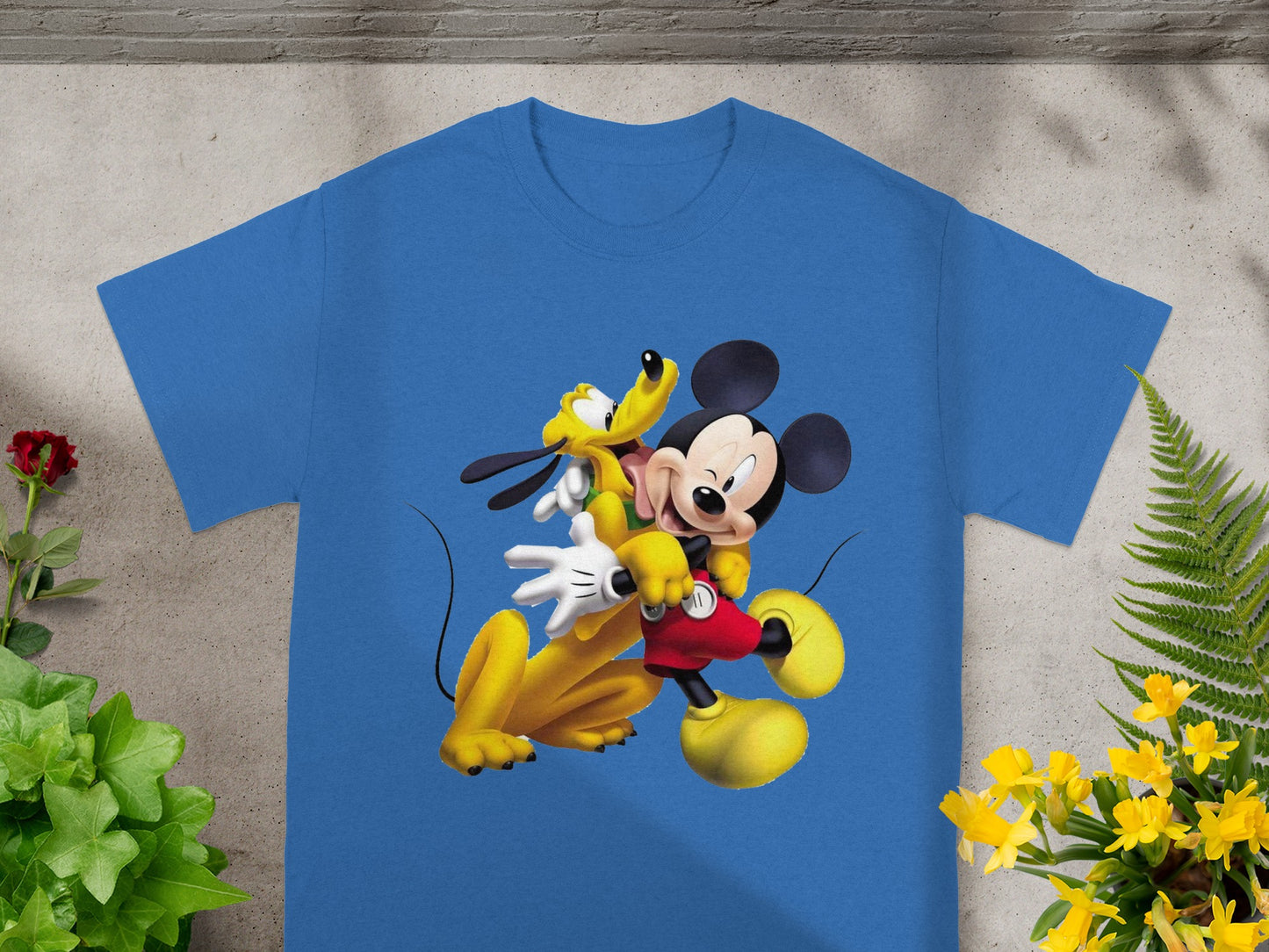 Blue t-shirt with Mickey Mouse and Pluto cuddling.