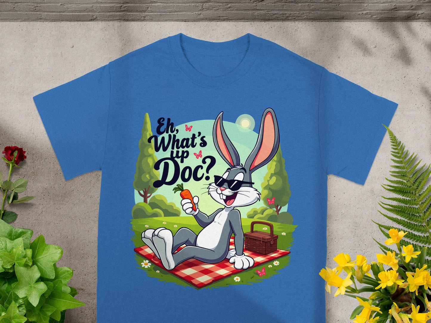 Bugs Bunny on a picnic blanket eating a carrot, with "Eh, What's Up Doc?" text.