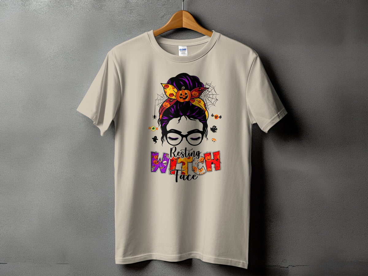 T-shirt with "Resting Witch Face" Halloween graphic featuring a messy bun and pumpkins.