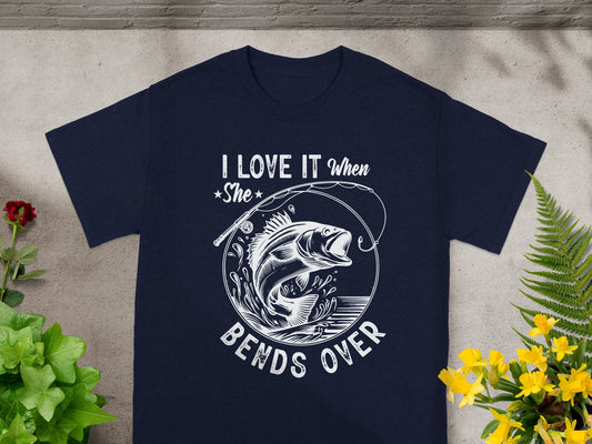 Navy t-shirt with white graphic "I LOVE IT when She BENDS OVER" and a fish.