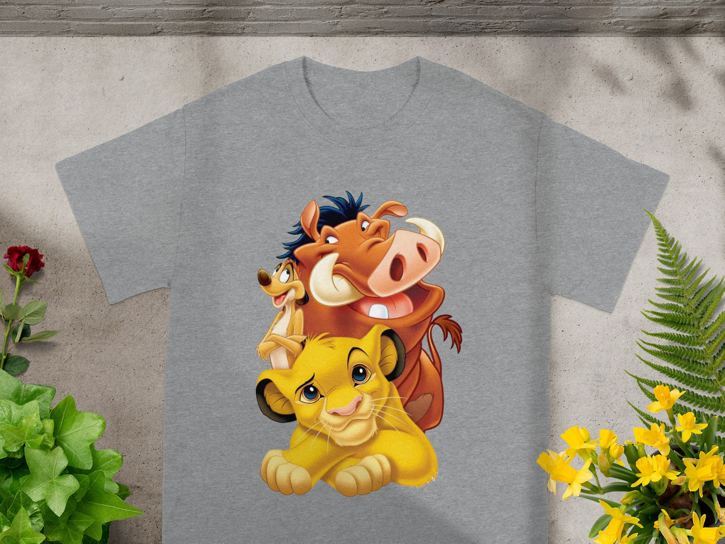 Simba, Timon, and Pumbaa from The Lion King on a gray t-shirt.