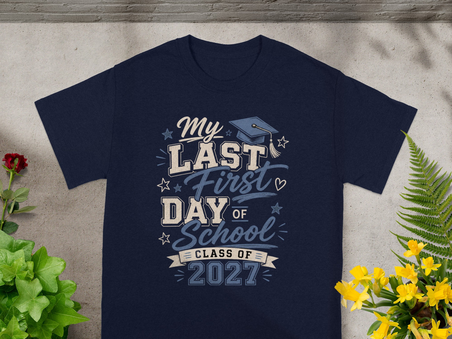 Navy t-shirt with "My Last First Day of School Class of 2027" text and graduation cap.