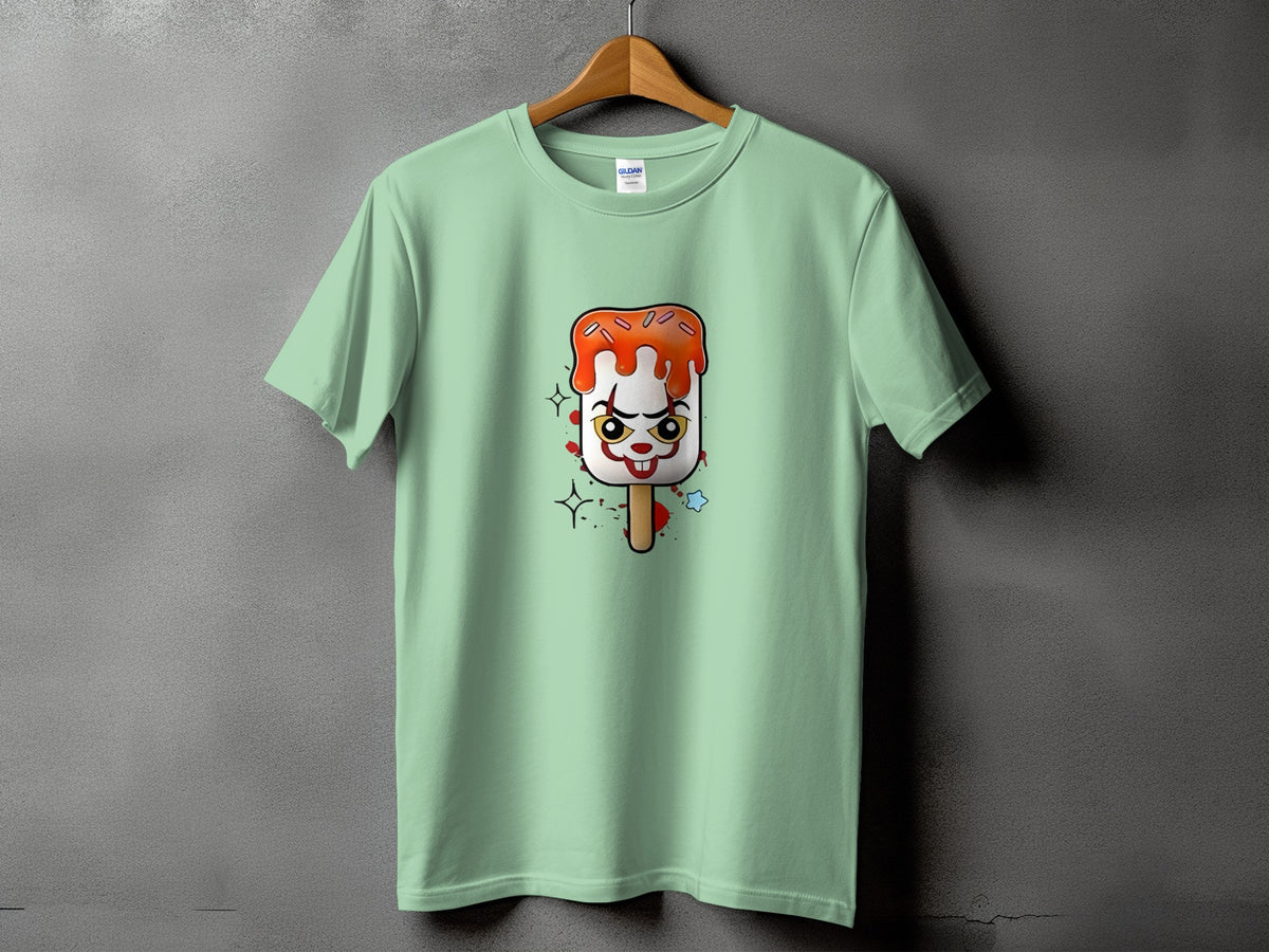 Pale green t-shirt with a cartoon ice pop featuring a clown face.