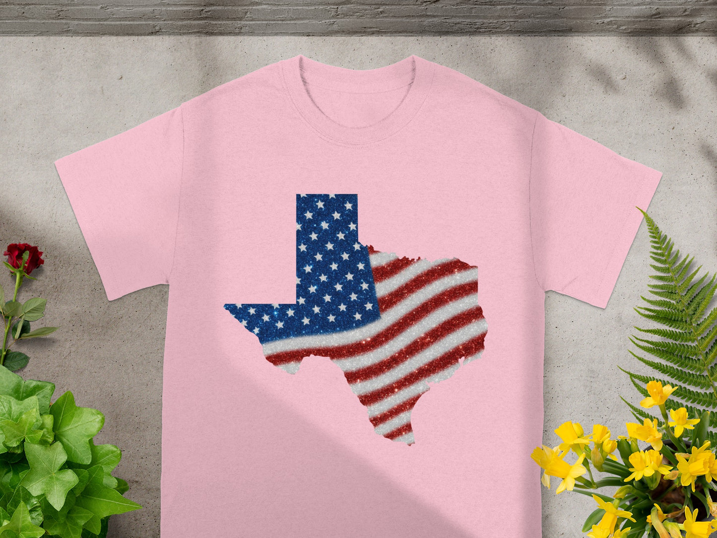 Pink t-shirt with a glitter Texas flag design.