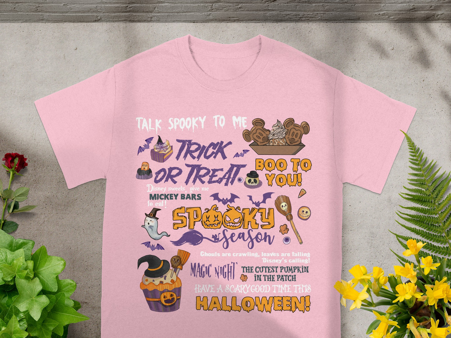 Pink t-shirt with Halloween designs and text "Talk Spooky to Me", "Trick or Treat", "Boo to You".