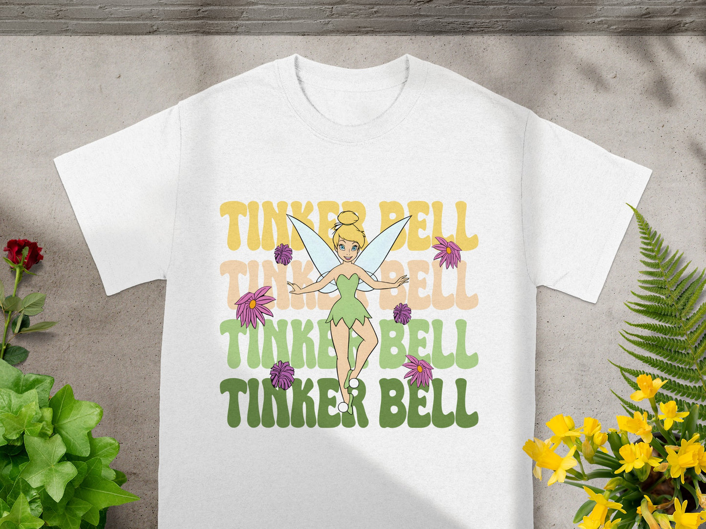 White t-shirt with Tinkerbell and "Tinker Bell" text.