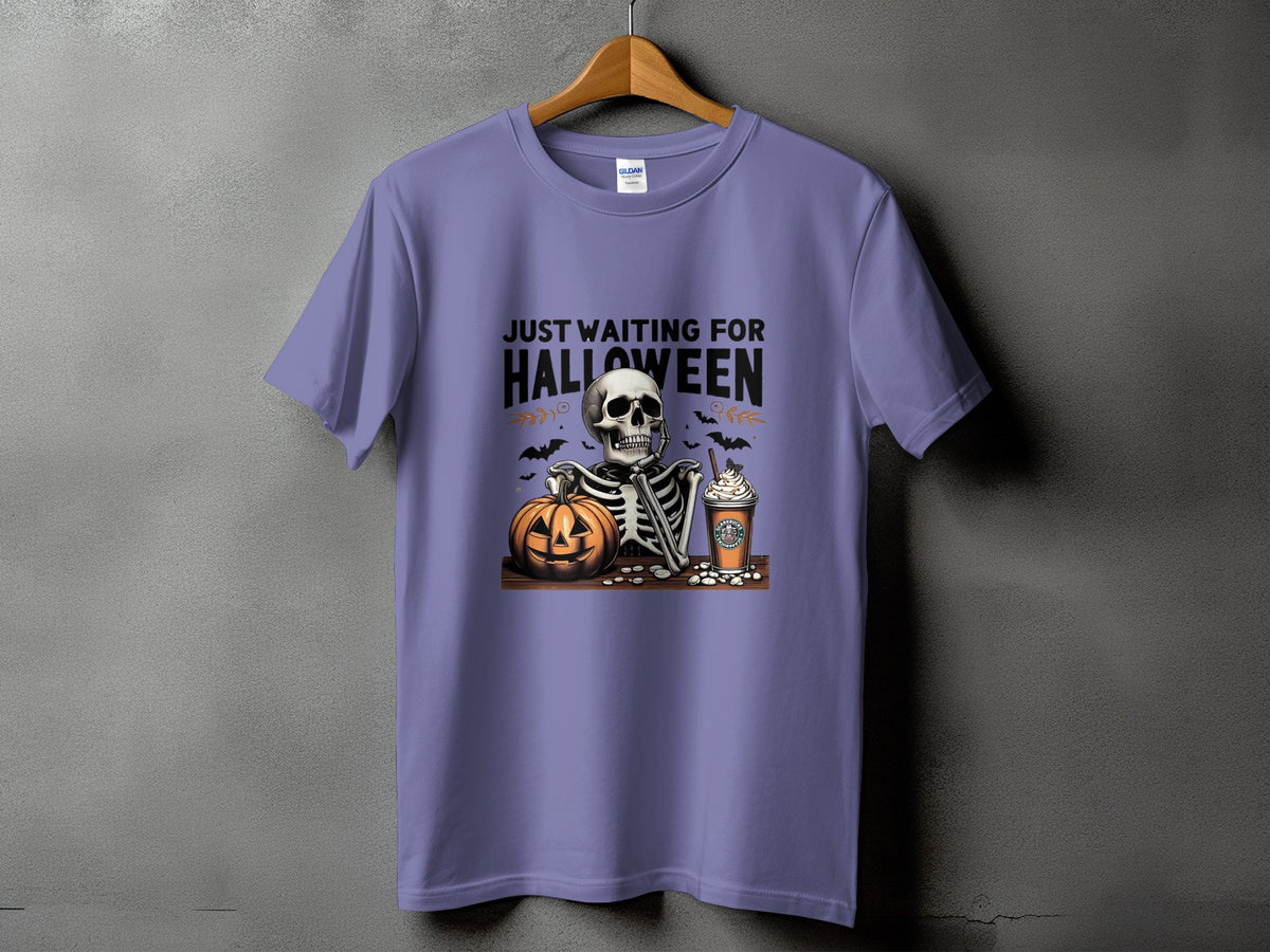 Purple t-shirt with skeleton, pumpkin, and coffee graphic, reads "Just Waiting for Halloween".