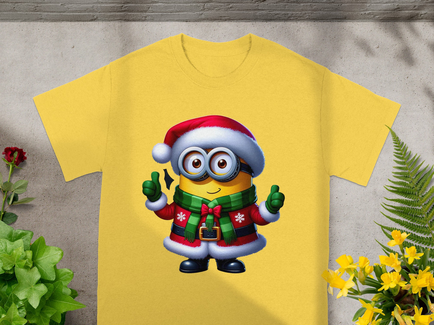 Yellow t-shirt featuring a Minion character in a Santa costume with thumbs up.