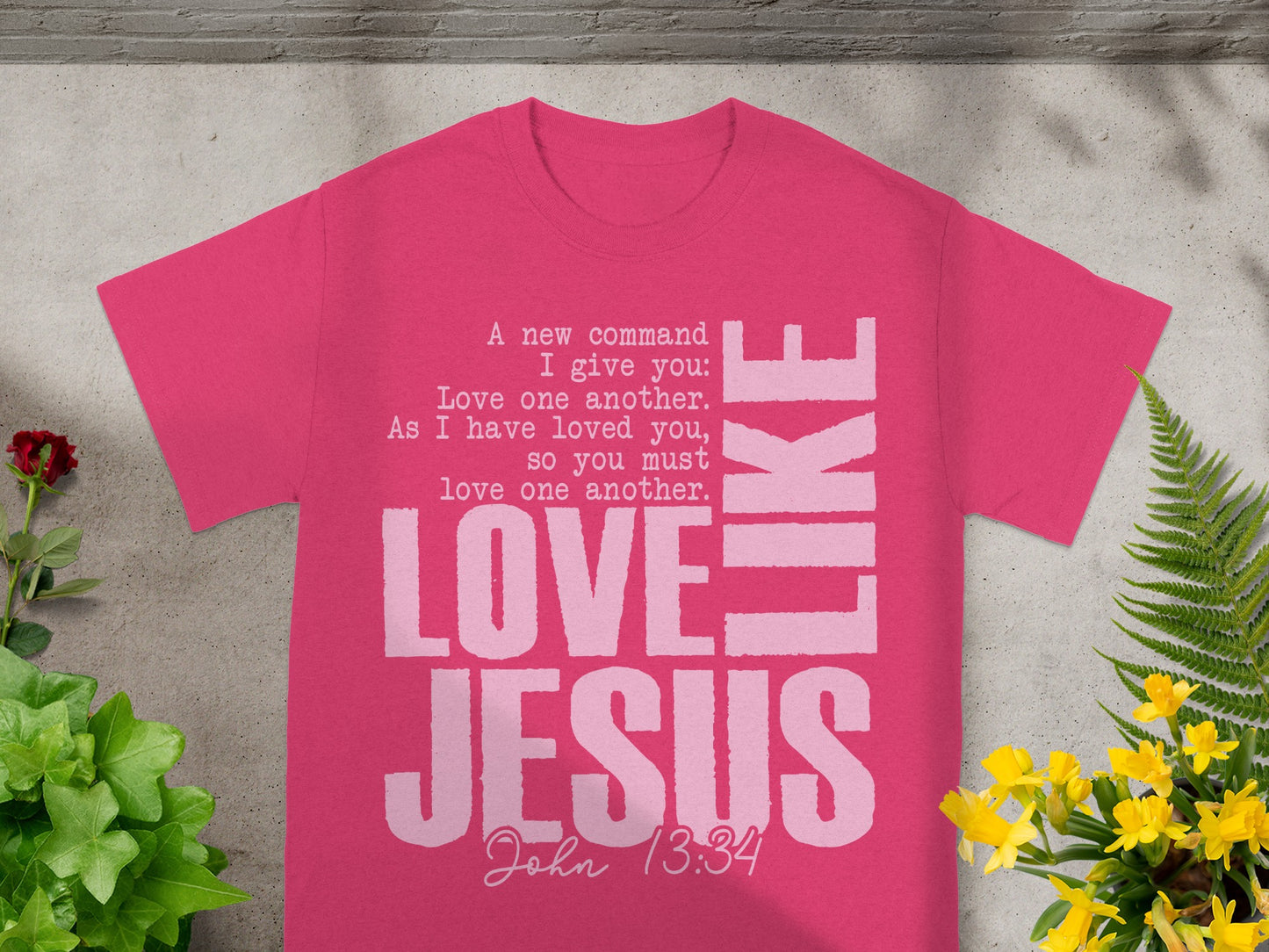 Pink t-shirt with "LOVE JESUS LIKE" text, and "John 13:34" scripture.