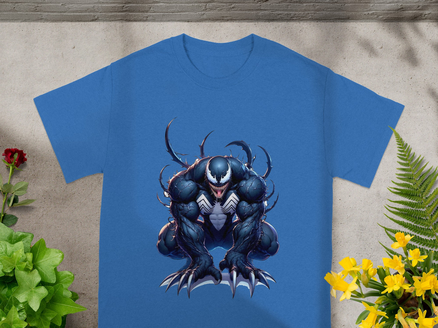 Blue t-shirt with Venom character art, crouching with claws extended.
