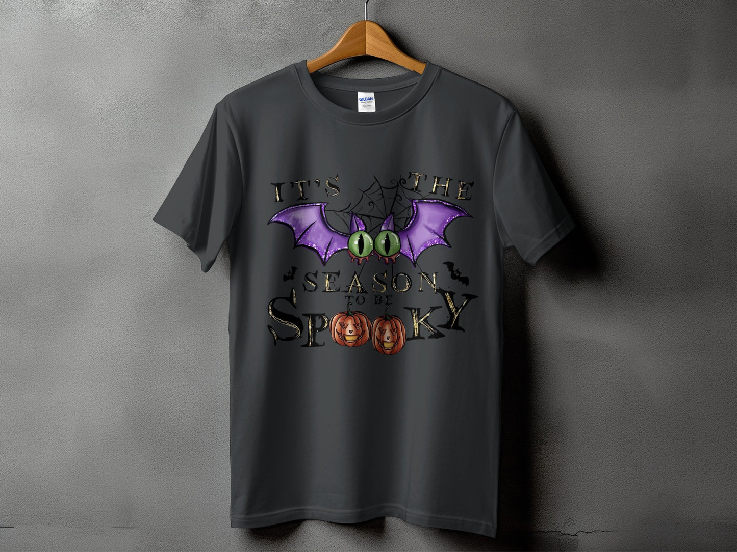 Dark gray t-shirt with "It's the season to be spooky" Halloween graphic.