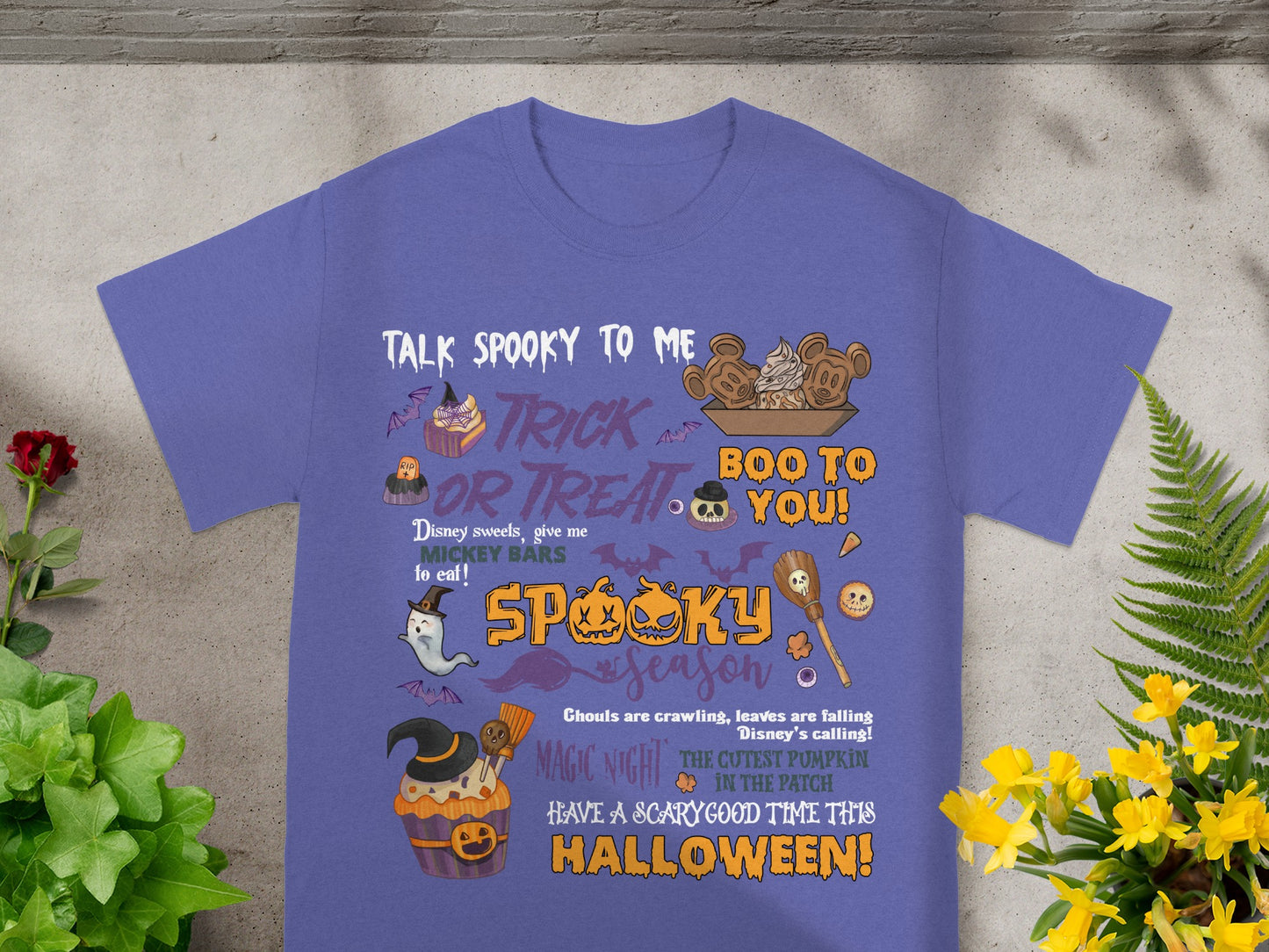 Purple t-shirt with Halloween graphics and text: "Talk Spooky to Me Trick or Treat Boo to You!"