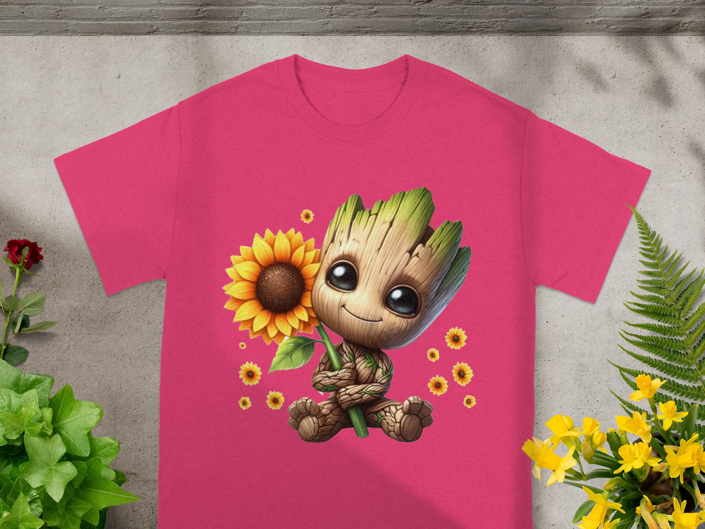 Pink t-shirt with Groot holding a sunflower and yellow flowers.