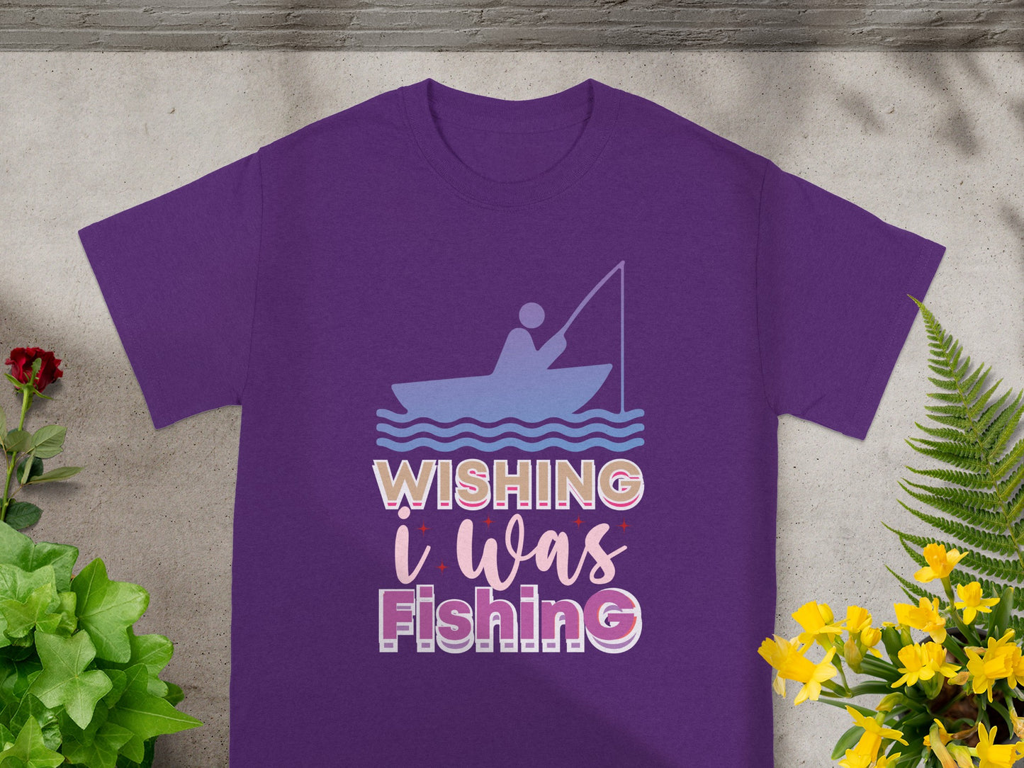 Purple t-shirt with "Wishing I Was Fishing" slogan and fishing graphics.