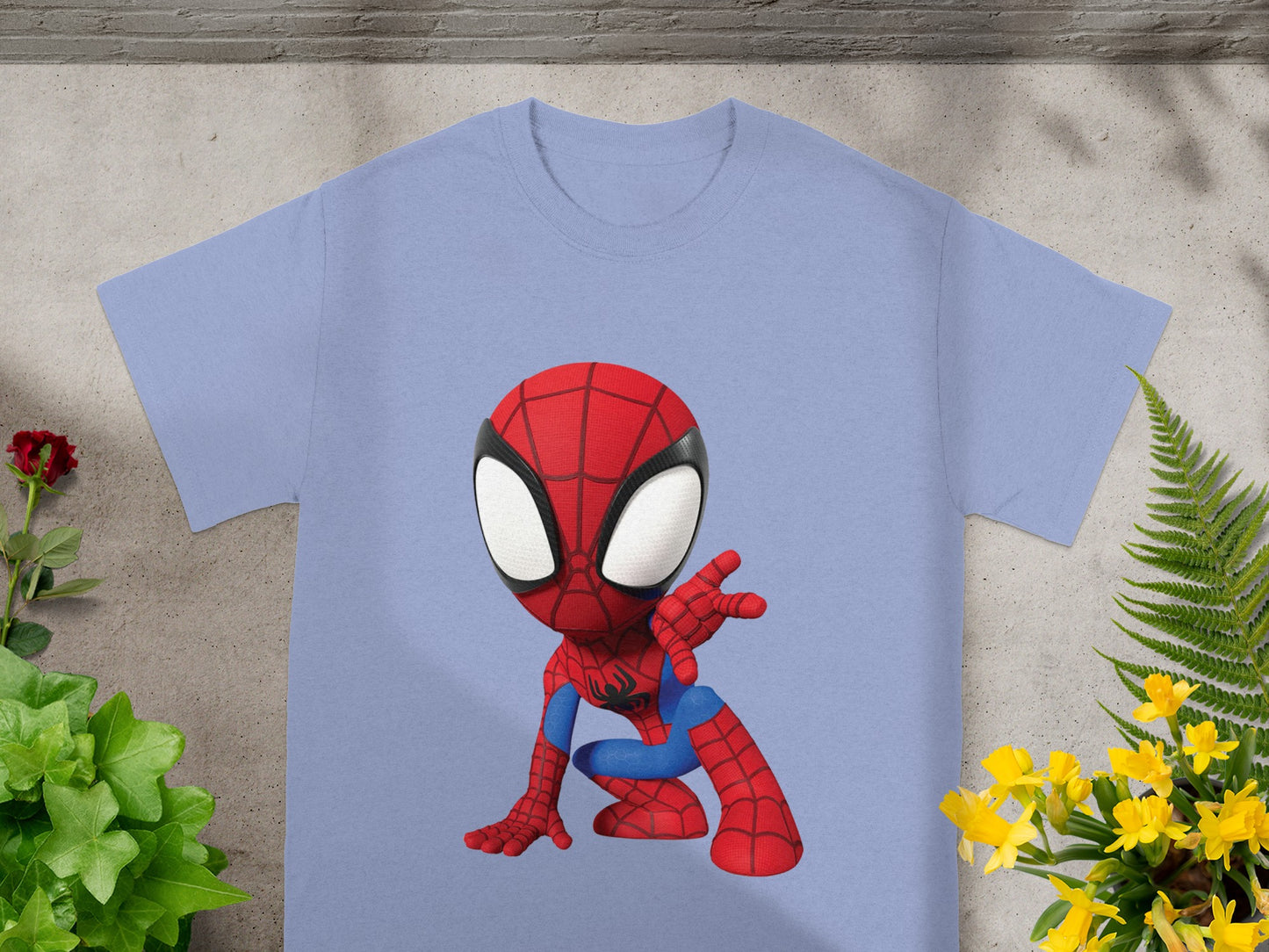 Light blue t-shirt with a cartoon Spiderman graphic ready to pounce.