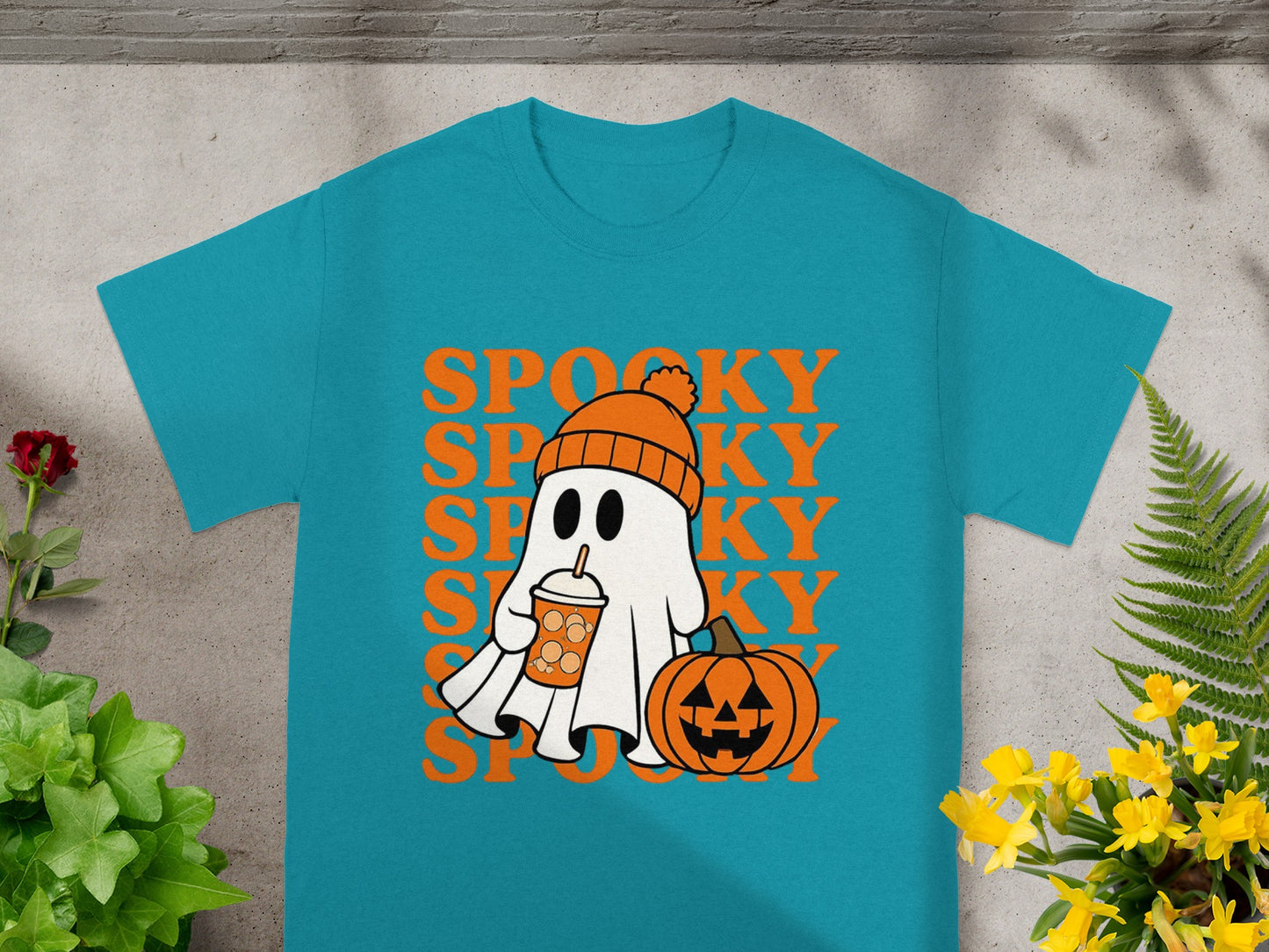 Teal t-shirt with a cartoon ghost, pumpkin, and "SPOOKY" text.