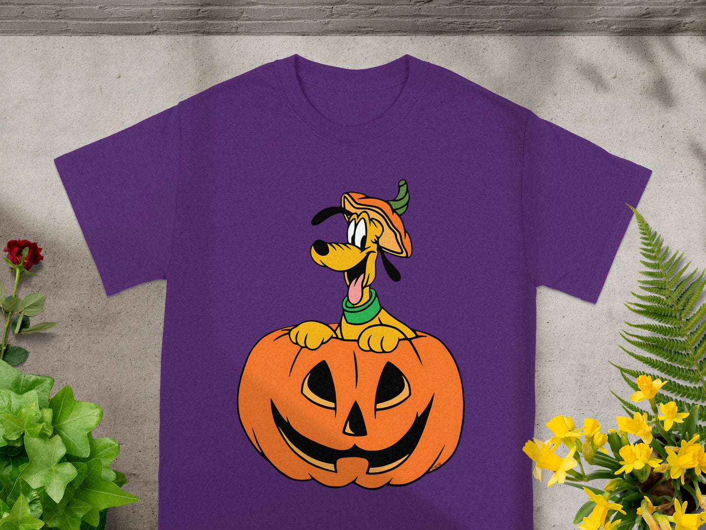 Purple t-shirt with Pluto peeking out of a jack-o'-lantern.