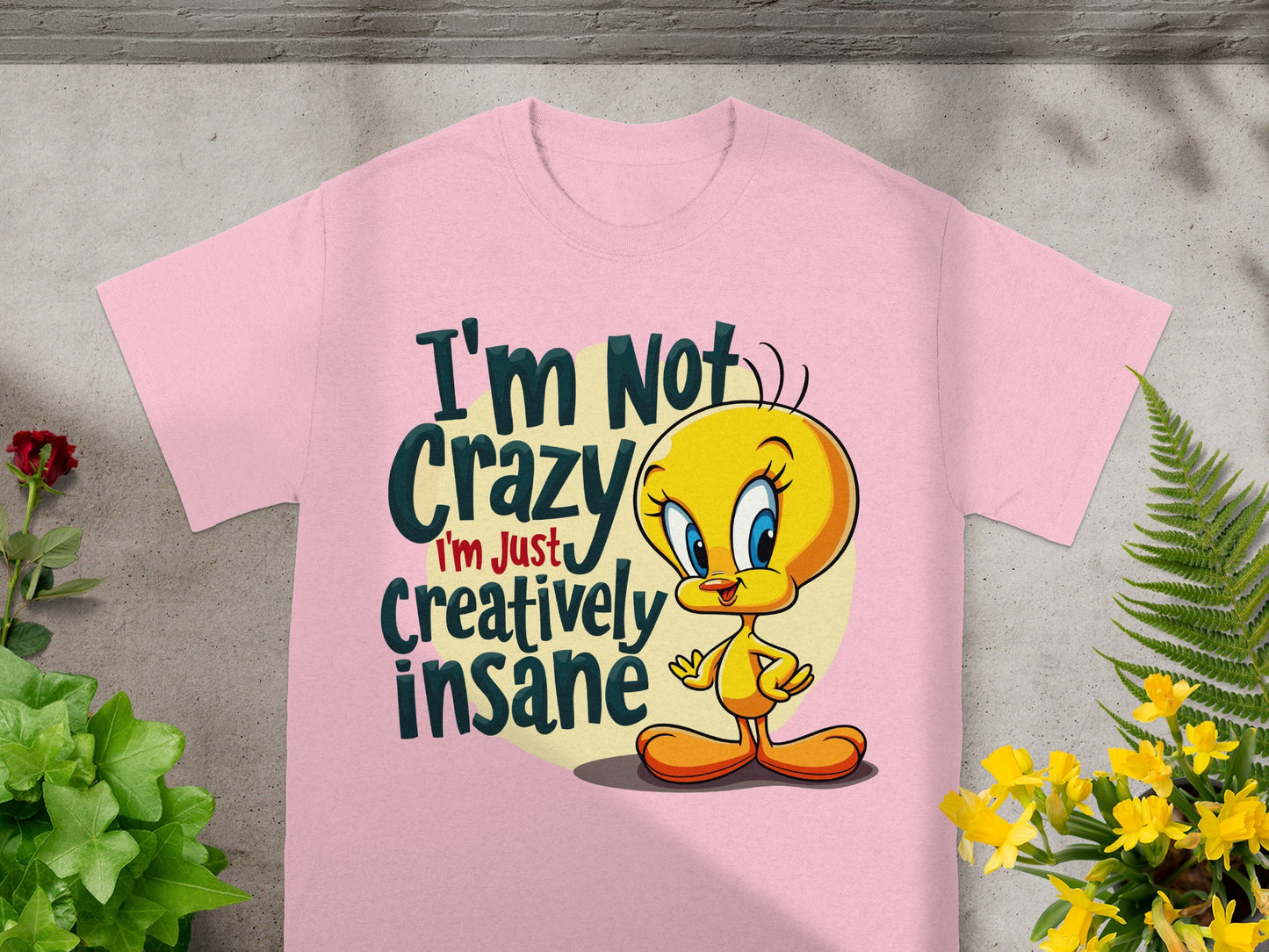 Pink t-shirt with Tweety Bird saying "I'm Not Crazy I'm Just Creatively Insane".