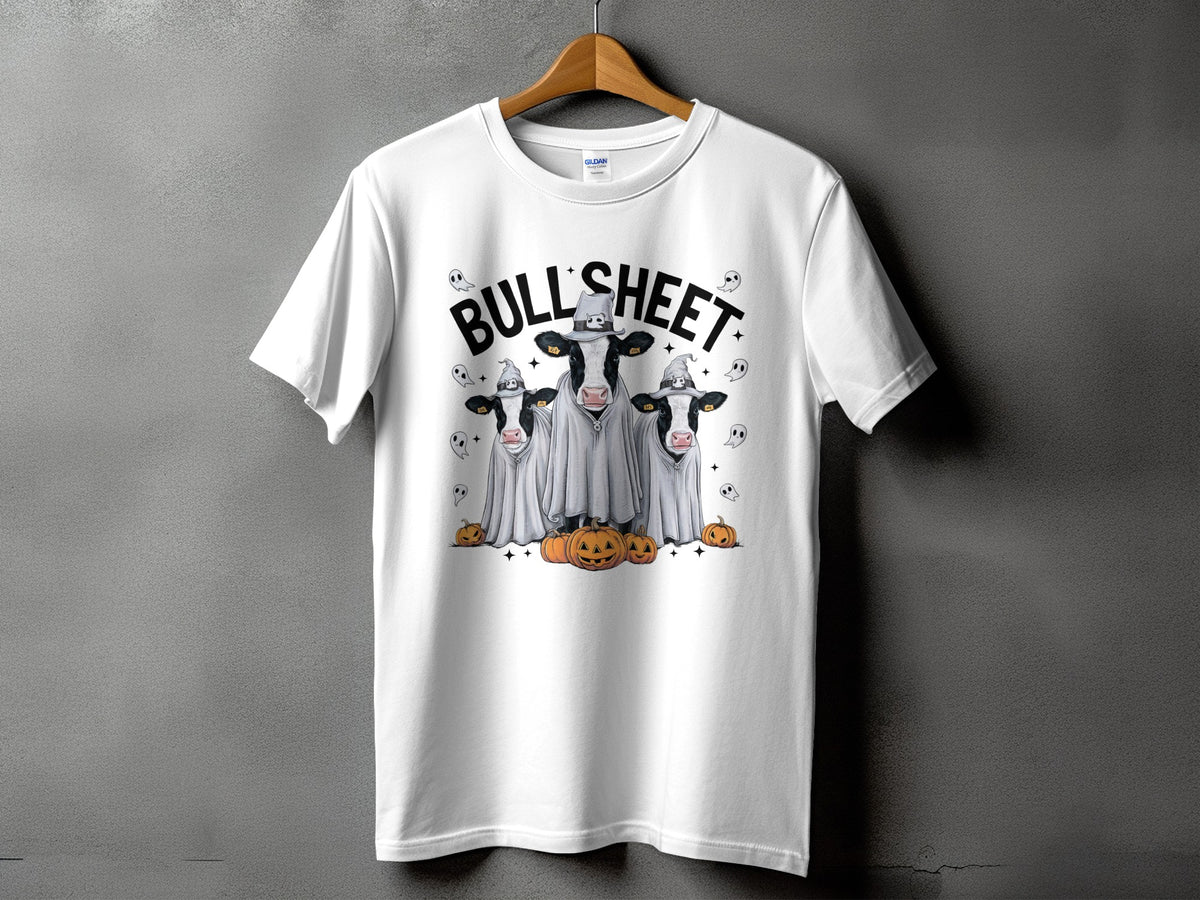 White t-shirt with three cows in ghost costumes and pumpkins, text says "BULL SHEET".