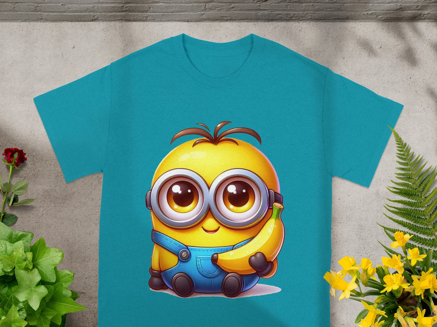 Blue t-shirt featuring a cartoon minion character holding a banana.
