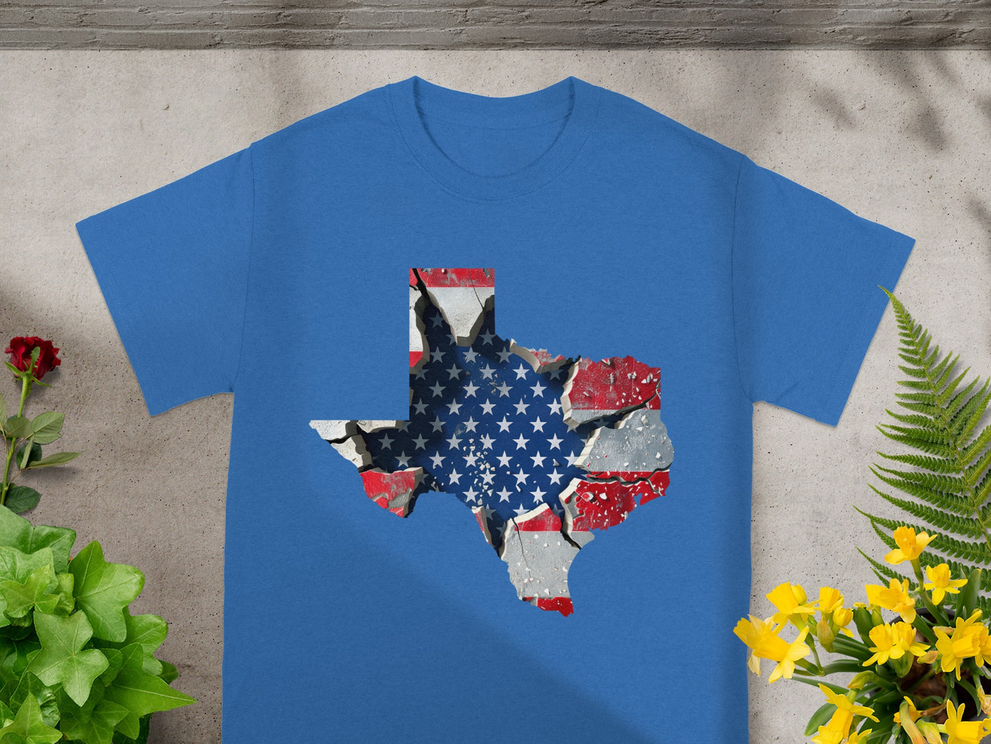 Blue t-shirt with a cracked Texas shape filled with the American flag.