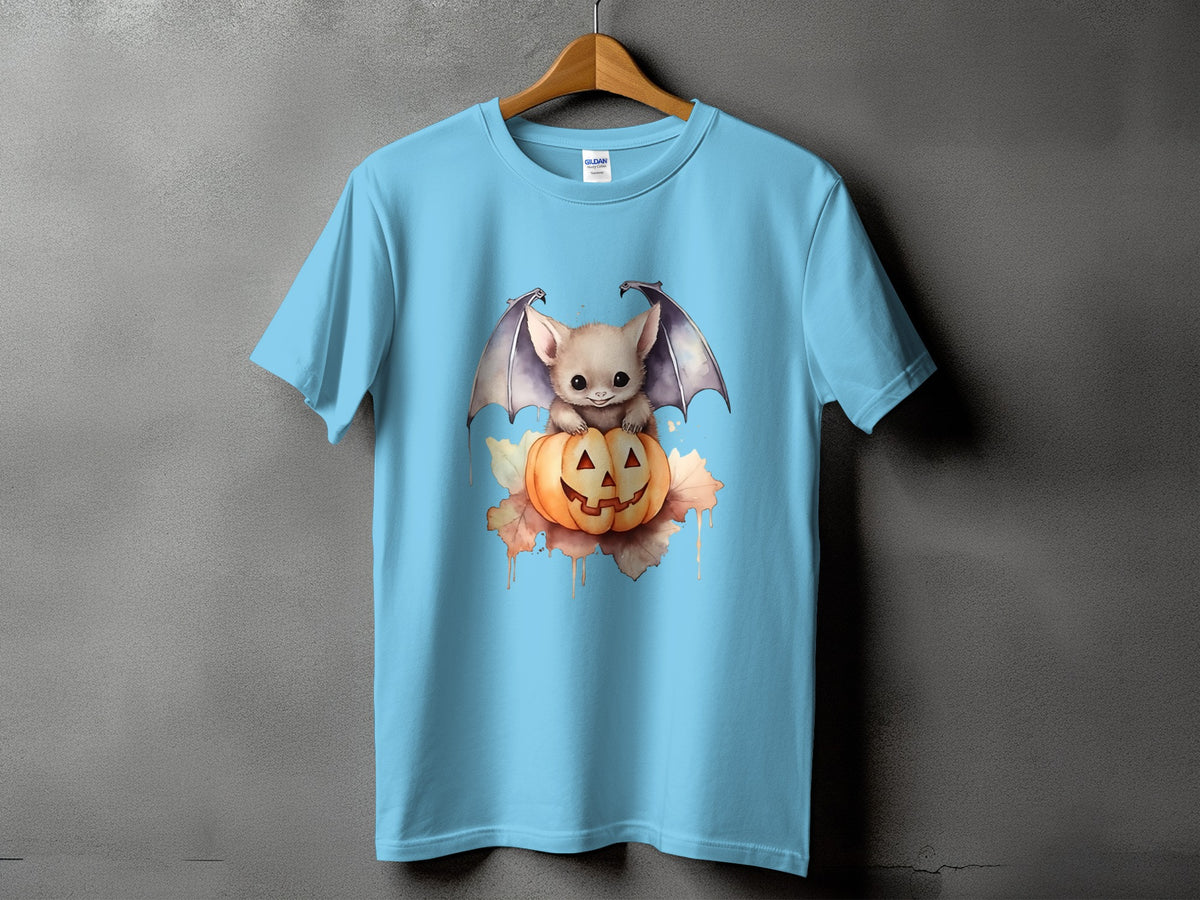 Light blue t-shirt with a cute baby bat sitting on a jack-o'-lantern.