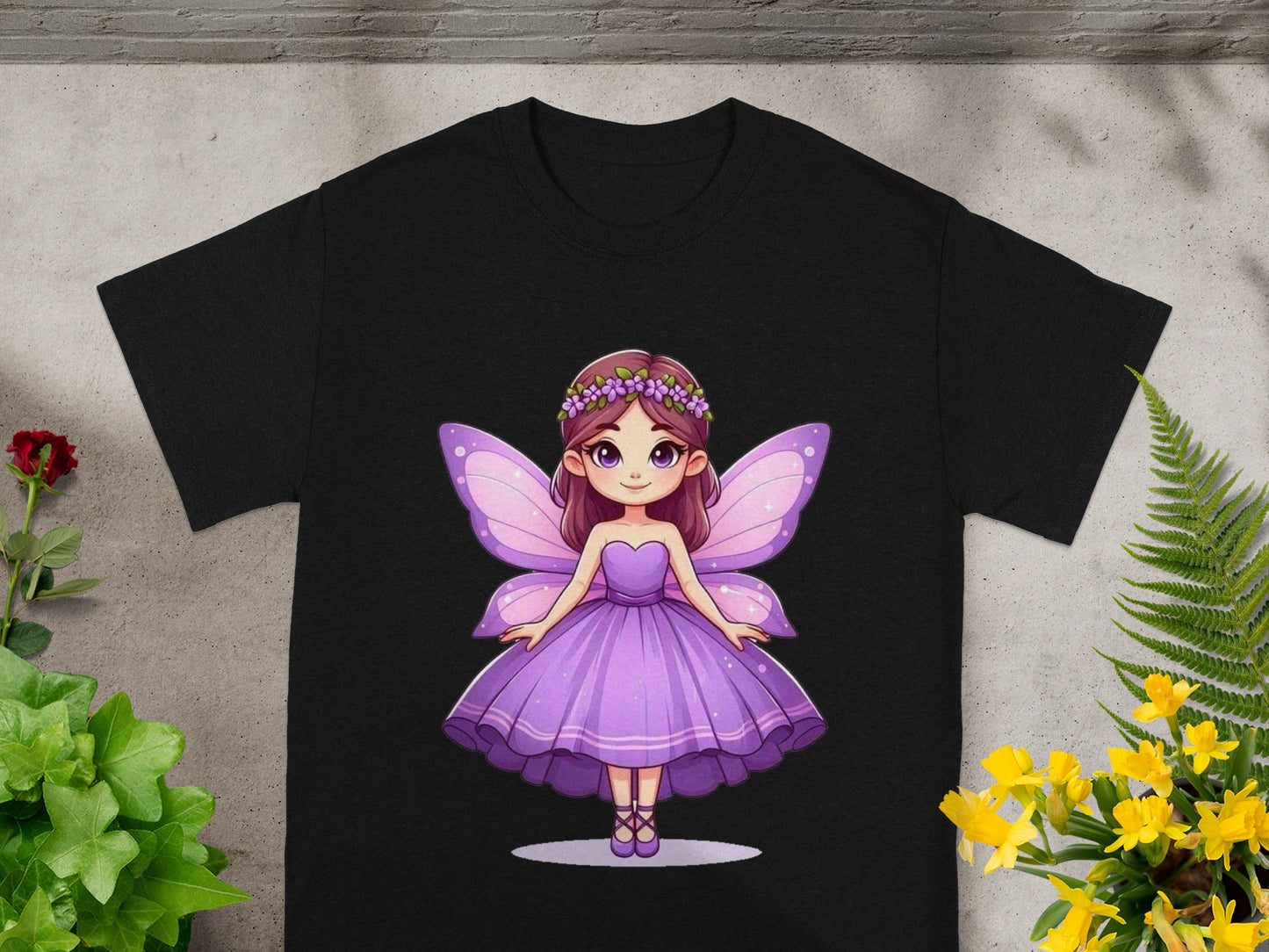 Fairy graphic with purple dress and wings on black t-shirt.