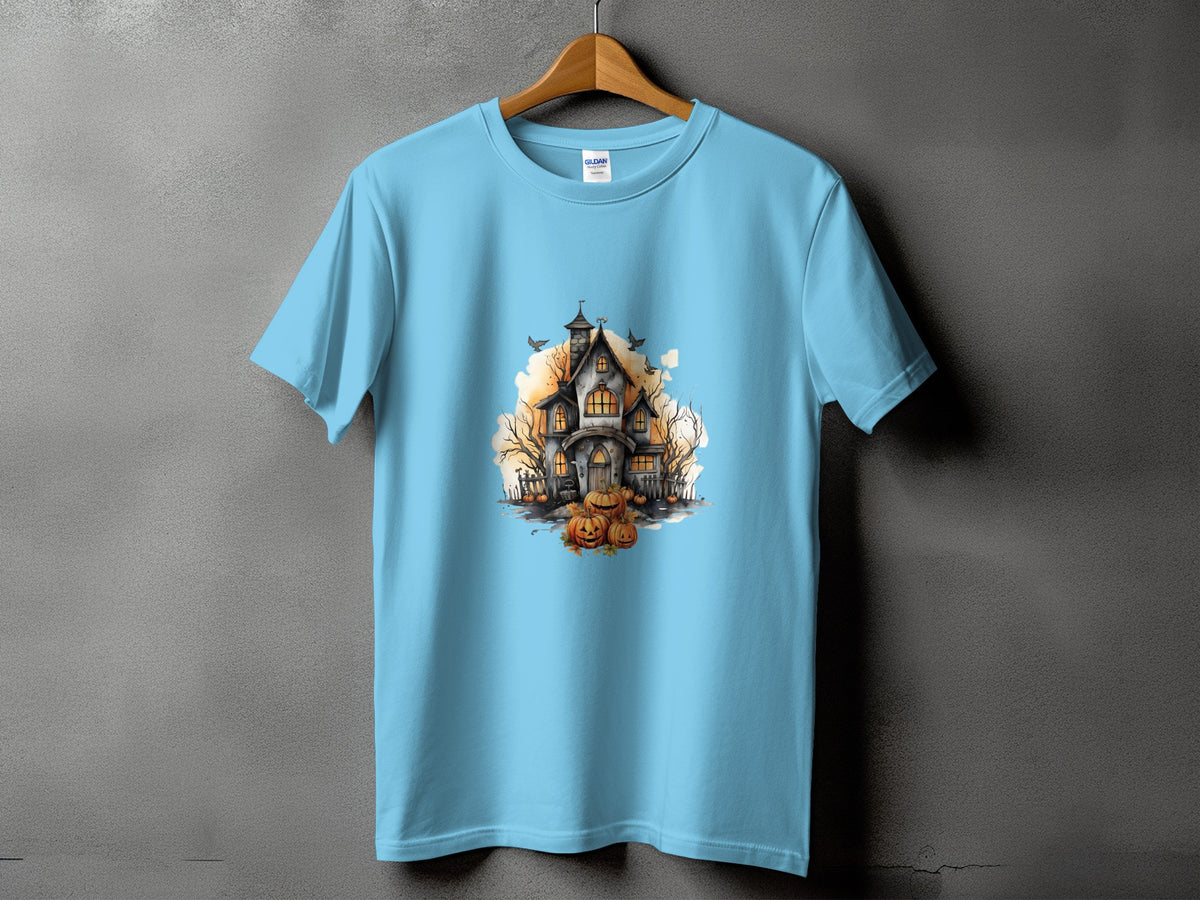 Light blue t-shirt with a watercolor print of a haunted house, pumpkins, and bats.