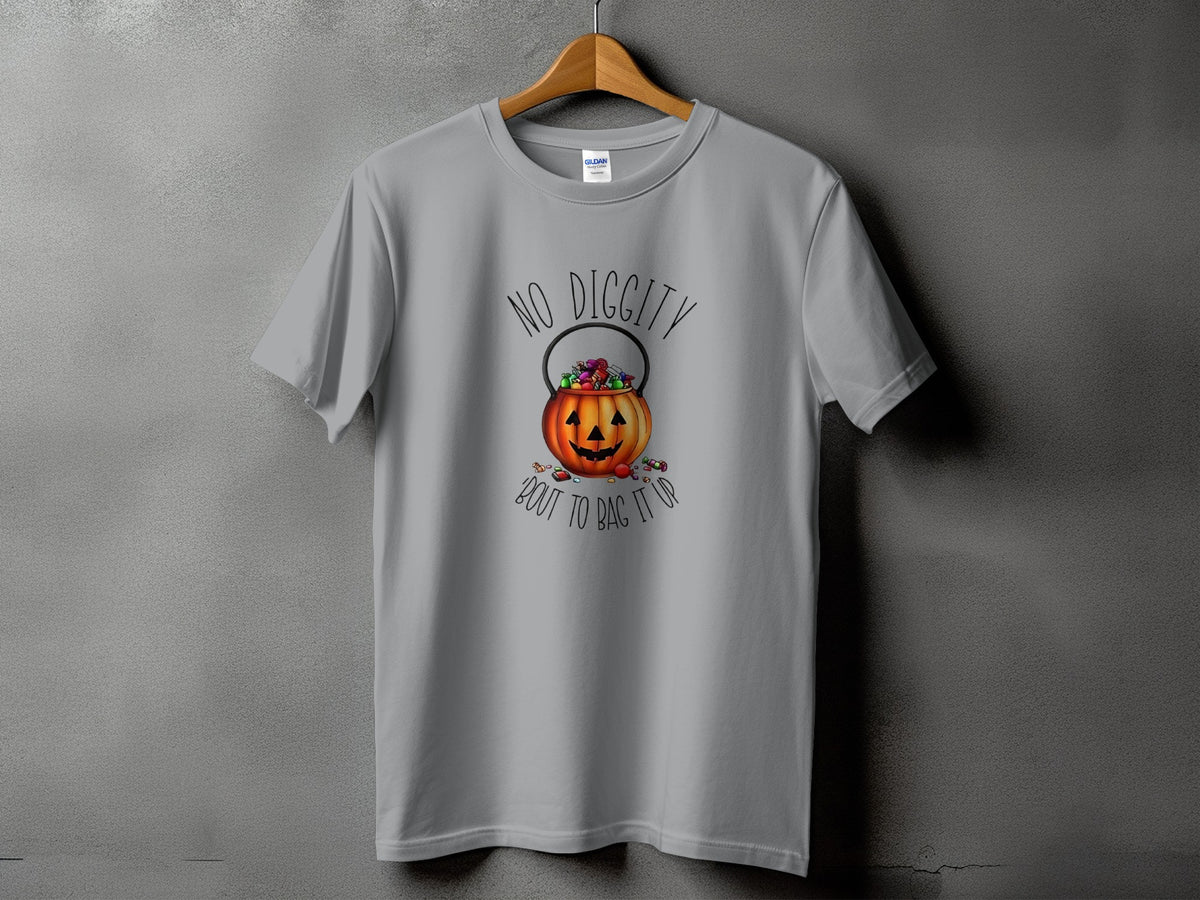 Grey t-shirt with a Halloween pumpkin candy bucket graphic and text.