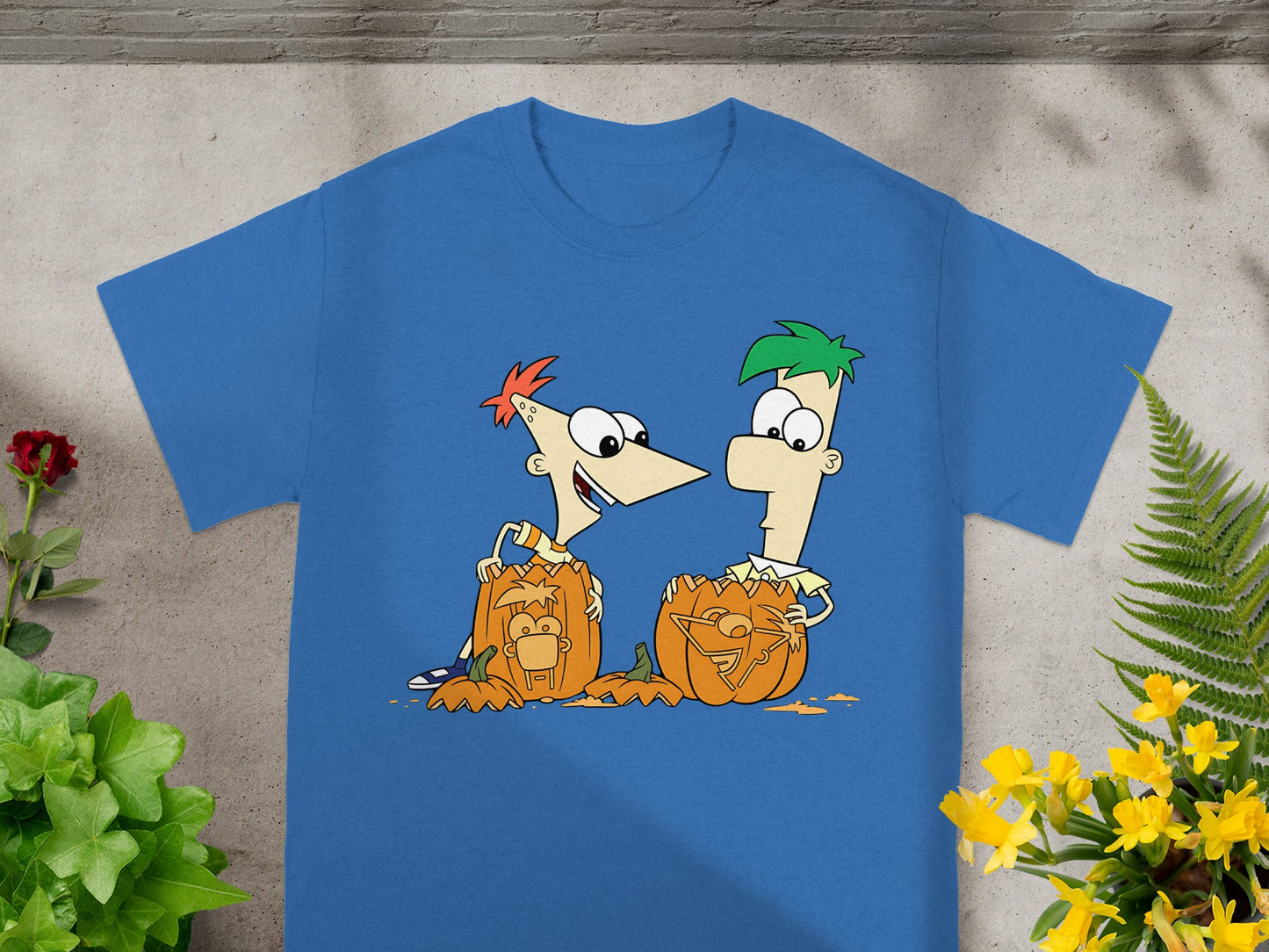Phineas and Ferb characters carving pumpkins with their faces on them.