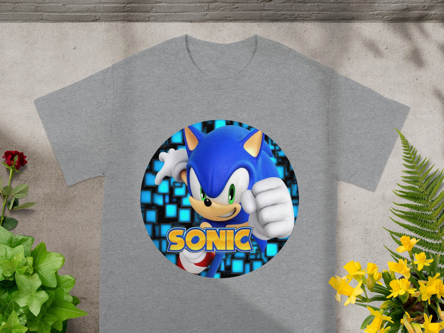 Gray t-shirt with Sonic the Hedgehog graphic and blue pixelated background.