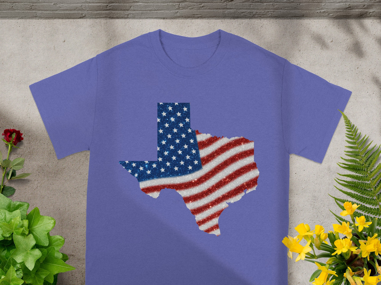 Purple t-shirt with Texas outline filled with American flag glitter design.