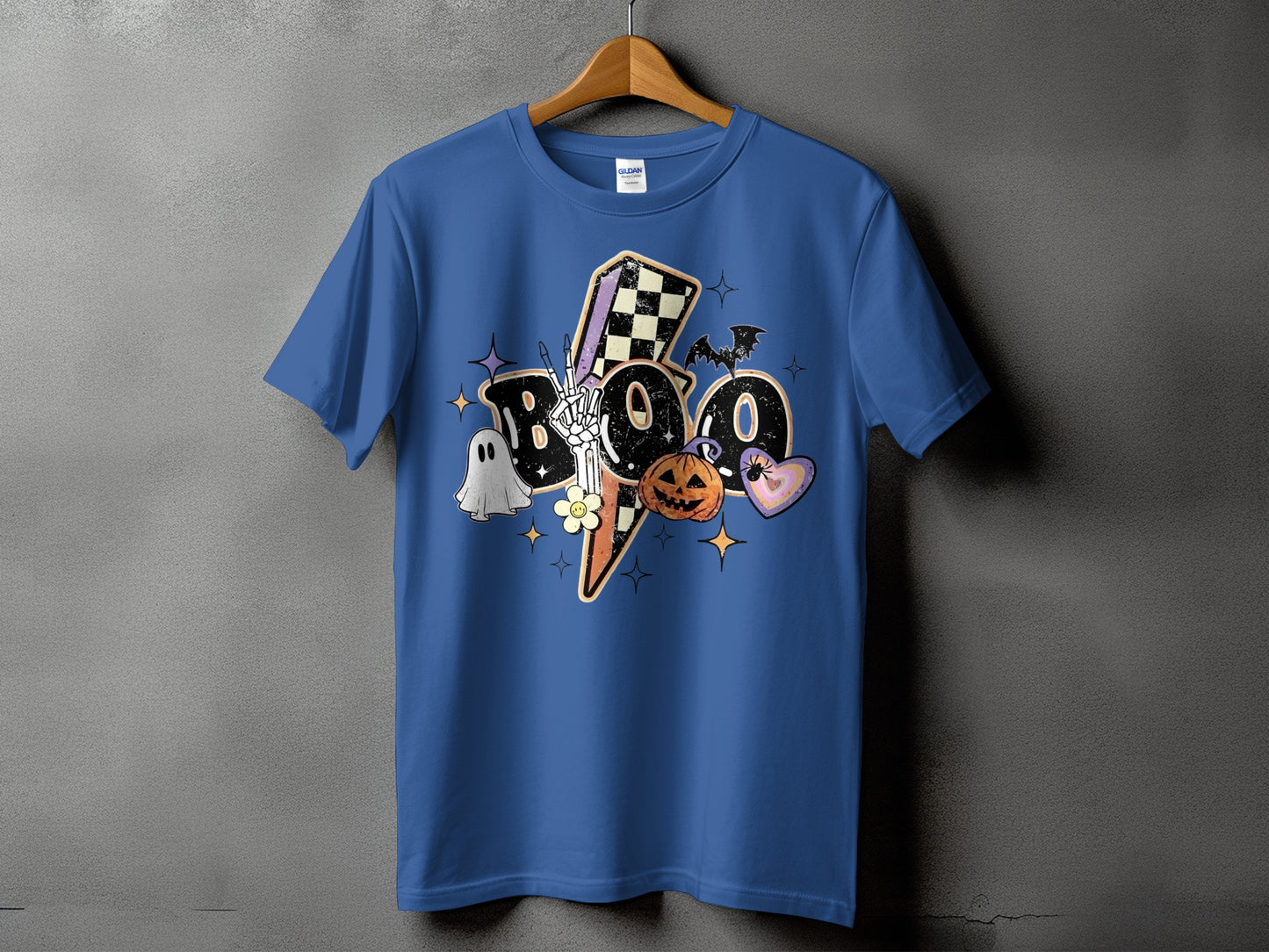 Blue t-shirt with "Boo" Halloween graphic featuring lightning, ghost, pumpkin, and bats.