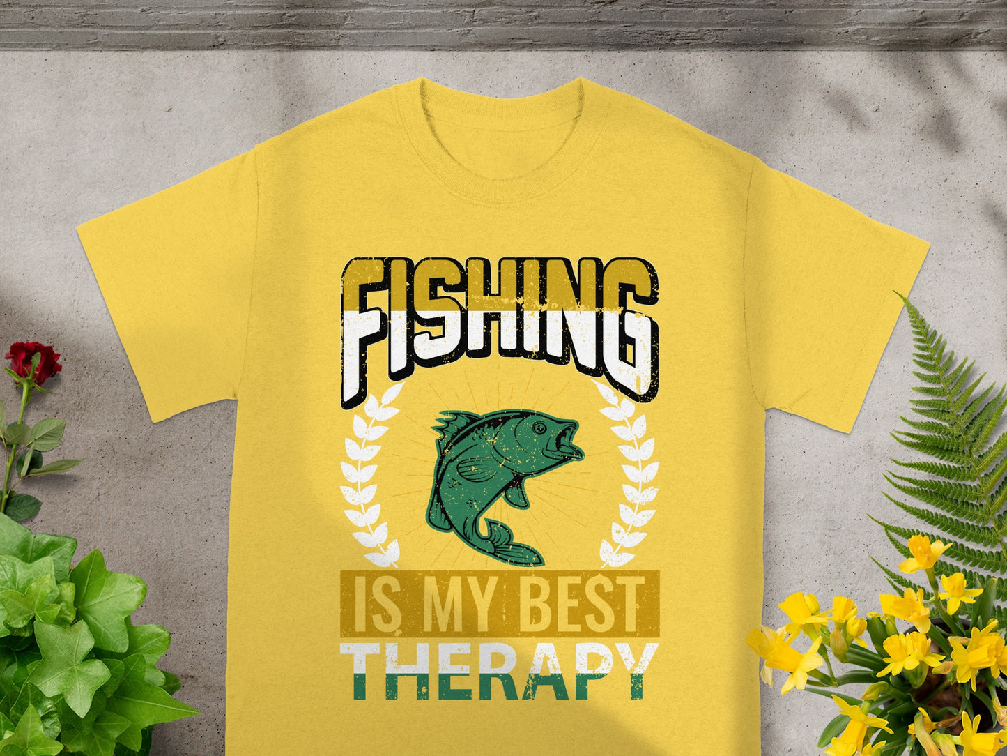 Yellow t-shirt with "FISHING IS MY BEST THERAPY" text and a green fish graphic.